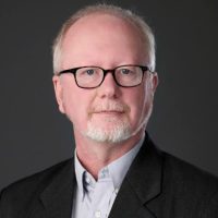 Prof Merlin Thomas