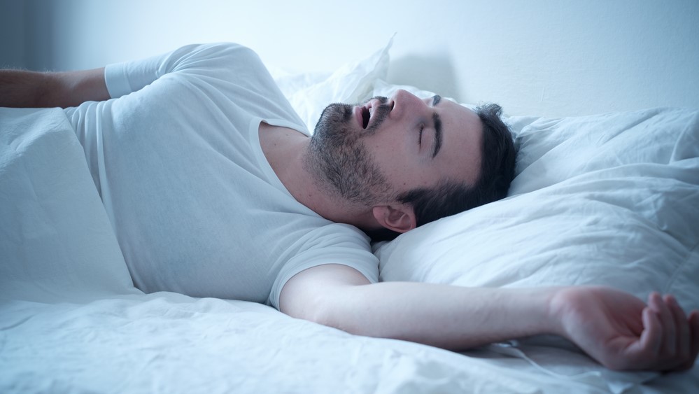 Man,Sleeping,In,His,Bed,And,Snoring,Loudly