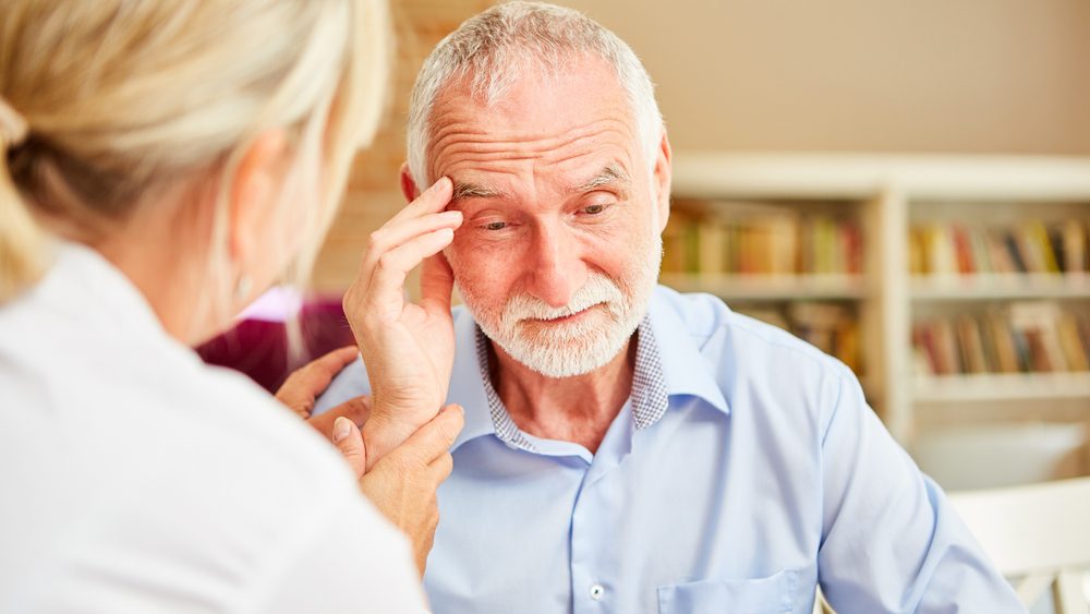 Senior,With,Dementia,Or,Alzheimer's,Is,Comforted,By,Caring,Female
