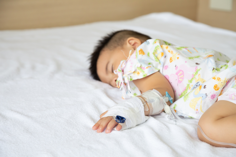 Asian,Baby,Boy,Sleeping,On,Bed,With,Infusion,Set,At