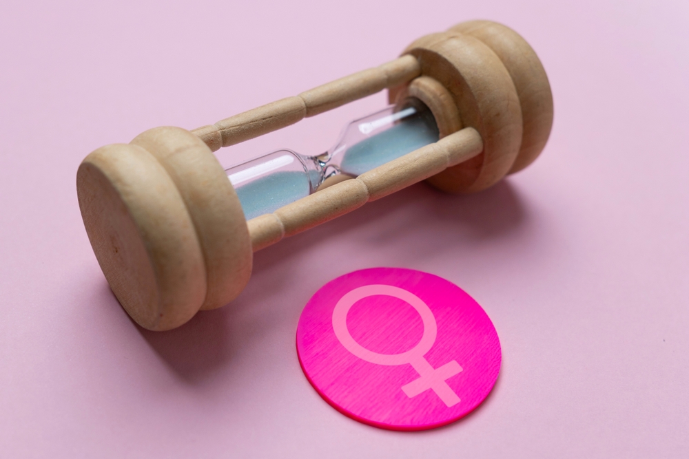 A,Wooden,Hourglass,With,The,Female,Gender,Symbol.,Women's,Health,