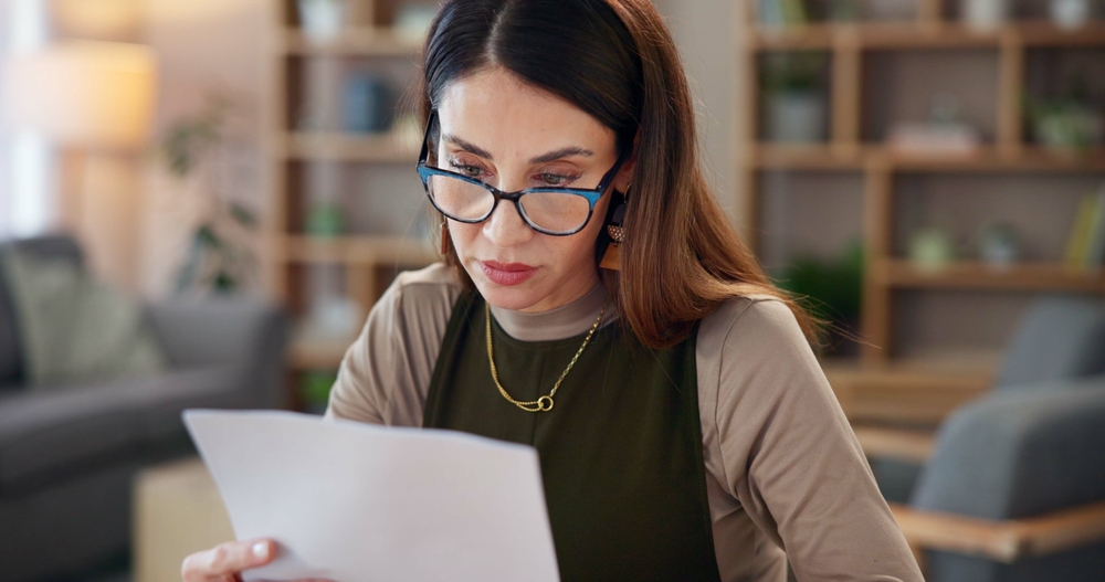 Thinking,,Woman,And,Reading,With,Paperwork,In,Home,Loan,Payment,