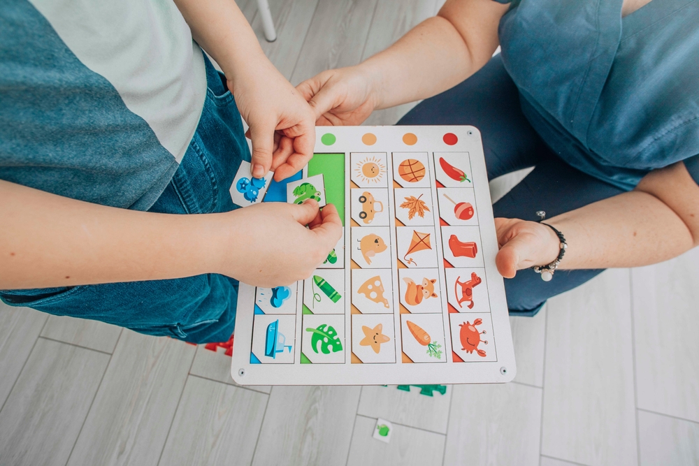 Child,Engaging,In,Color-matching,On,Educational,Board,In,Structured,Learning