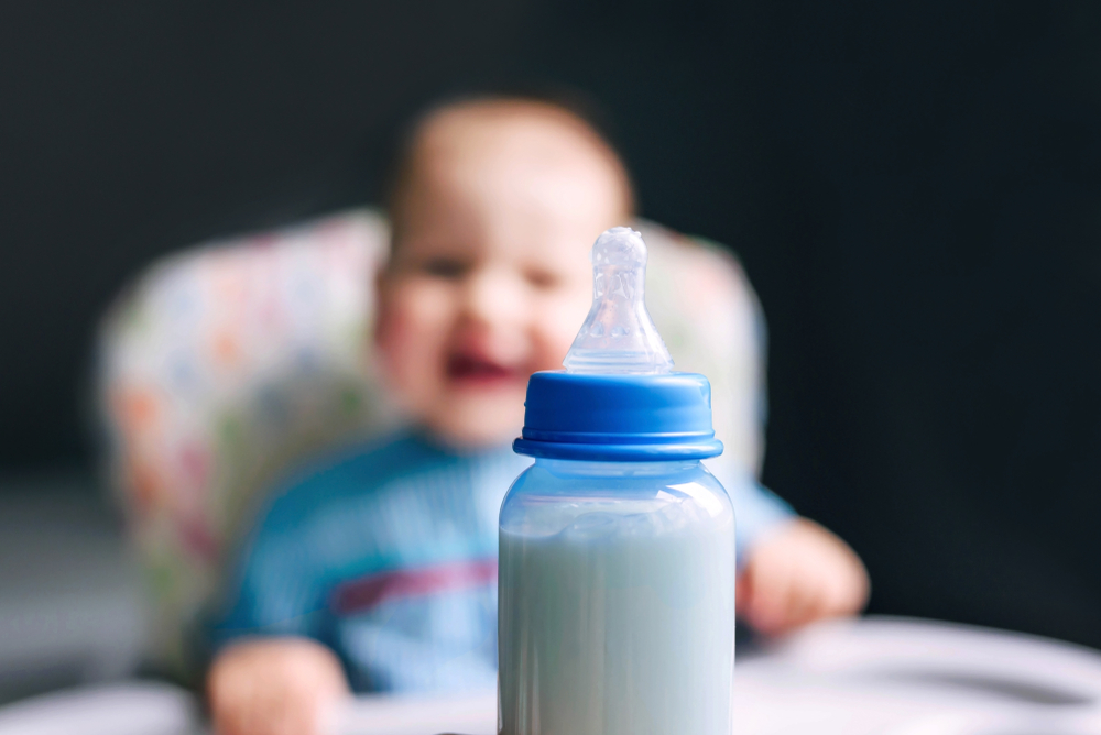 Happy,Boy,Of,10,Months,Drinking,Milk,From,A,Bottle